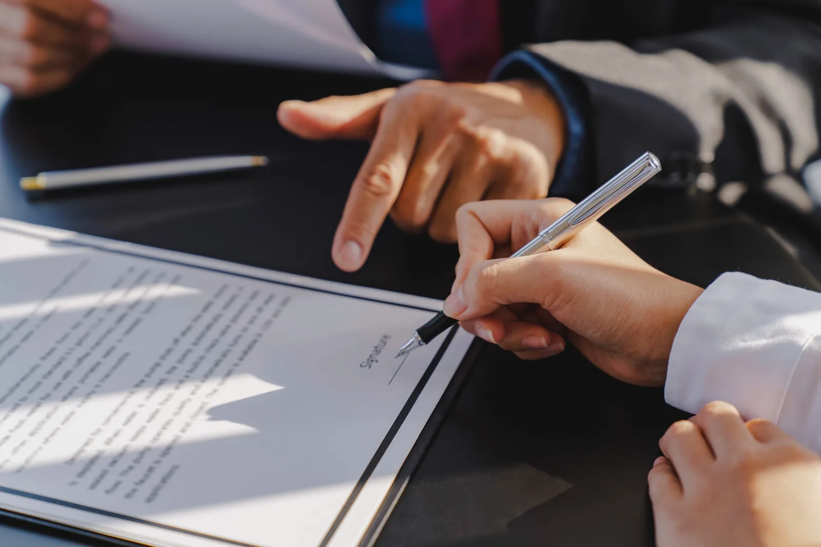 Signing documentation during a boat sale and purchase transaction